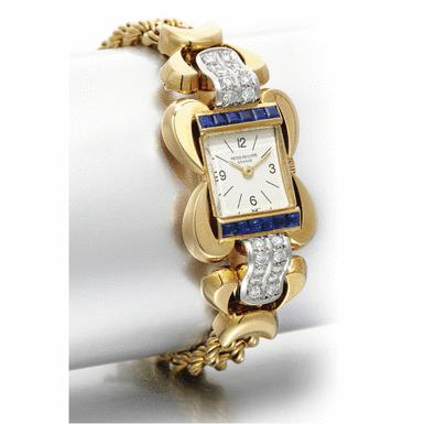 PATEK PHILIPPE - A LADY'S FINE 18K YELLOW GOLD, PLATINUM, DIAMOND AND SAPPHIRE-SET BRACELET WATCH 1946 REF 2238J MVT 941872 CASE 647464