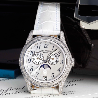 PATEK PHILIPPE - A LADY'S WHITE GOLD AND DIAMOND-SET AUTOMATIC ANNUAL CALENDAR SWEEP SECONDS WRISTWATCH WITH MOON-PHASES AND MOTHER-OF-PEARL DIAL CIRCA 2007 REF 4937G MVT 3582392 CASE 4379584