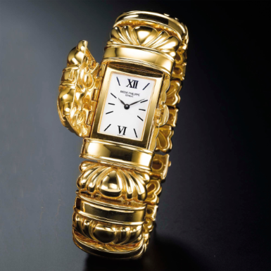 PATEK PHILIPPE - A LADY'S YELLOW GOLD RECTANGULAR BRACELET WATCH WITH CONCEALED DIAL CIRCA 1999 REF 4955 MVT 1971008 CASE 4084882