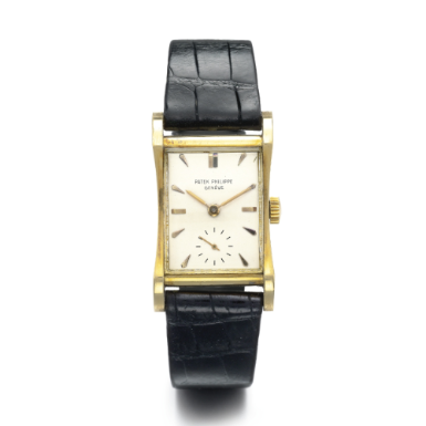 PATEK PHILIPPE - AN 18K YELLOW GOLD FLARED CURVED RECTANGULAR WRISTWATCH 1950 REF 2456J MVT 972429 CASE 656211