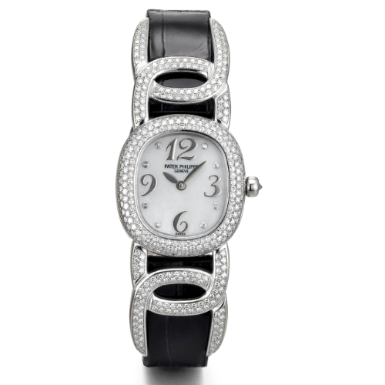 PATEK PHILIPPE - A LADY'S WHITE GOLD AND DIAMOND-SET ELLIPTICAL WRISTWATCH WITH MOTHER-OF-PEARL DIAL CIRCA 1999 REF 4832G MVT 1969750 CASE 4057654