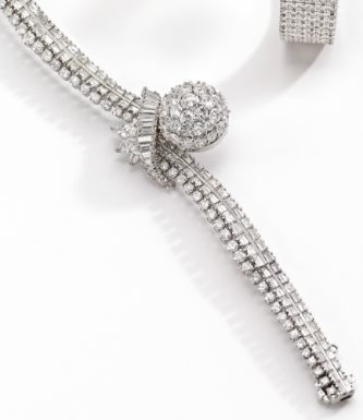 LECOULTRE - A LADY'S PLATINUM AND DIAMOND-SET CONCEALED DIAL BRACELET WATCH CIRCA 1955