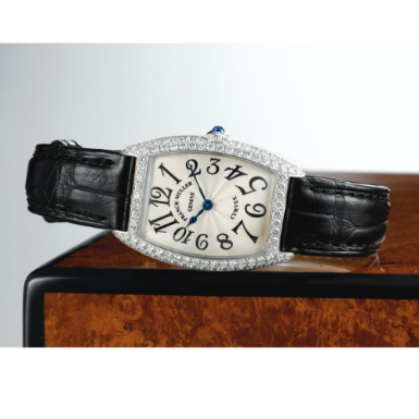 FRANCK MULLER - A LADY'S WHITE GOLD AND DIAMOND-SET TONNEAU FORM WRISTWATCH CIRCA 2000 REF 1752 QZ D CURVEX