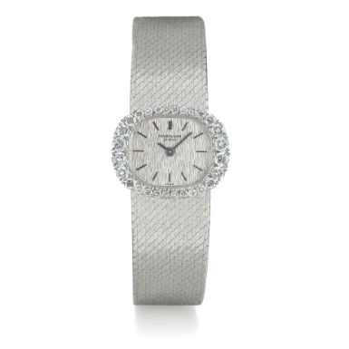 PATEK PHILIPPE - A WHITE GOLD AND DIAMOND-SET OVAL BRACELET WATCH 1970 REF 3394/1 MVT 1240307 CASE 2683202