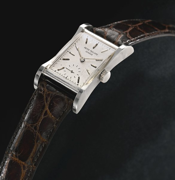 Patek Philippe A FINE AND RARE PLATINUM FLARED CURVED RECTANGULAR WRISTWATCH 1950 REF 2456P MVT 972649 CASE 661963