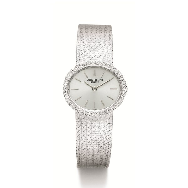 Patek Philippe A LADY'S WHITE GOLD AND DIAMOND-SET OVAL BRACELET WATCH MADE IN 1970 REF 3350/1 MVT 1241576 CASE 2689692