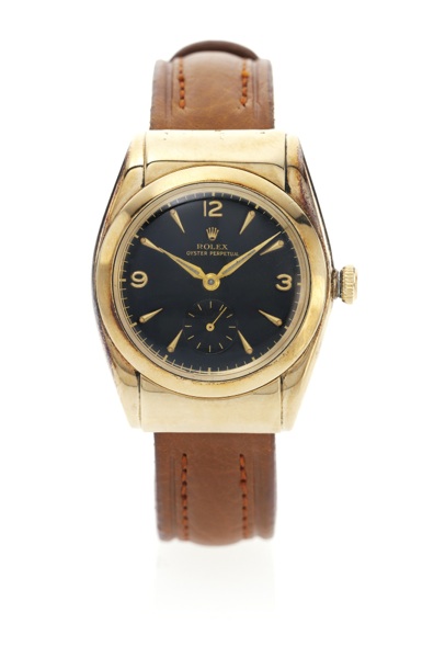 Rolex A FINE AND RARE 14K YELLOW GOLD AUTOMATIC WRISTWATCH WITH BLACK DIAL AND HOODED LUGS REF 3065 BUBBLE BACK CIRCA 1940