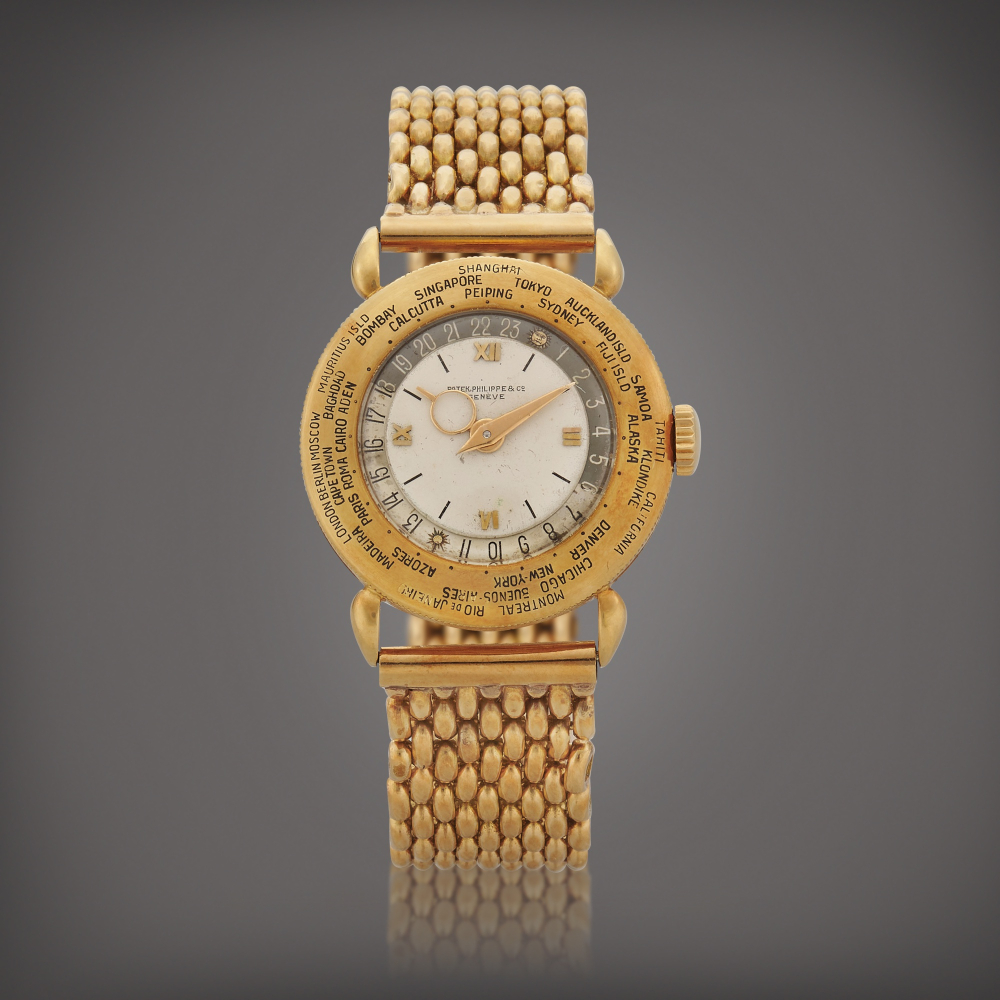 World Time Reference 1415 A yellow gold world time wristwatch with bracelet Made in 1942    World Time  1415  1942