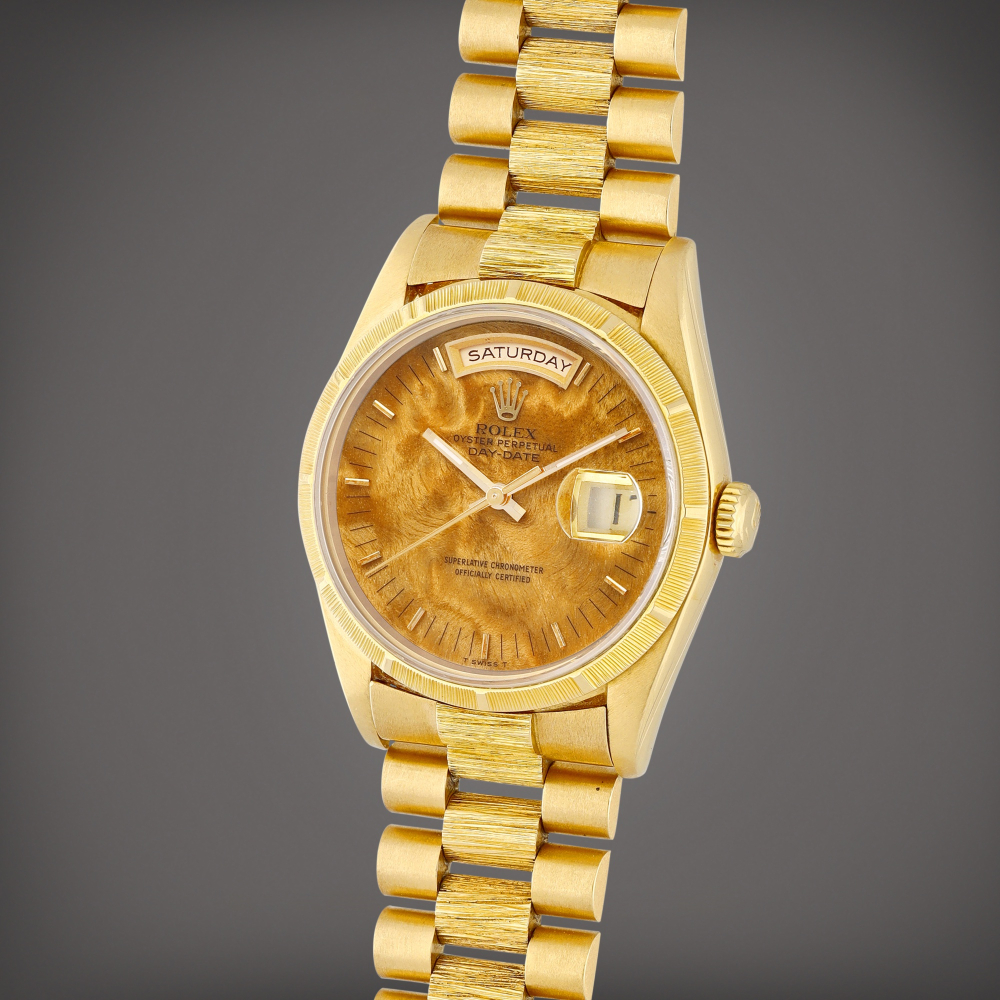 Day-Date, Reference 18248 A yellow gold wristwatch with day, date, burl wood dial and bracelet Circa 1979