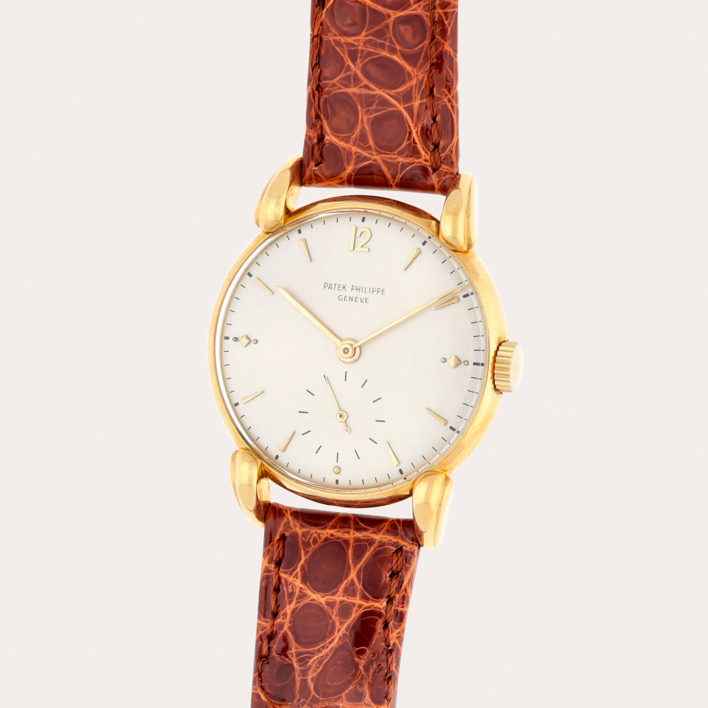 Patek Philippe Reference 1590 | A yellow gold wristwatch with teardrop lugs | Made in 1949