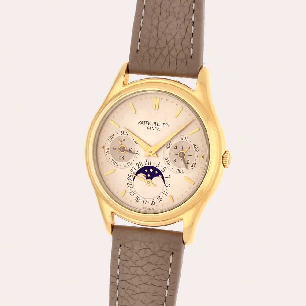 Patek Philippe Reference 3940 | A yellow gold perpetual calendar wristwatch with moon phases, leap year indication and gilt dial | Made in 1988