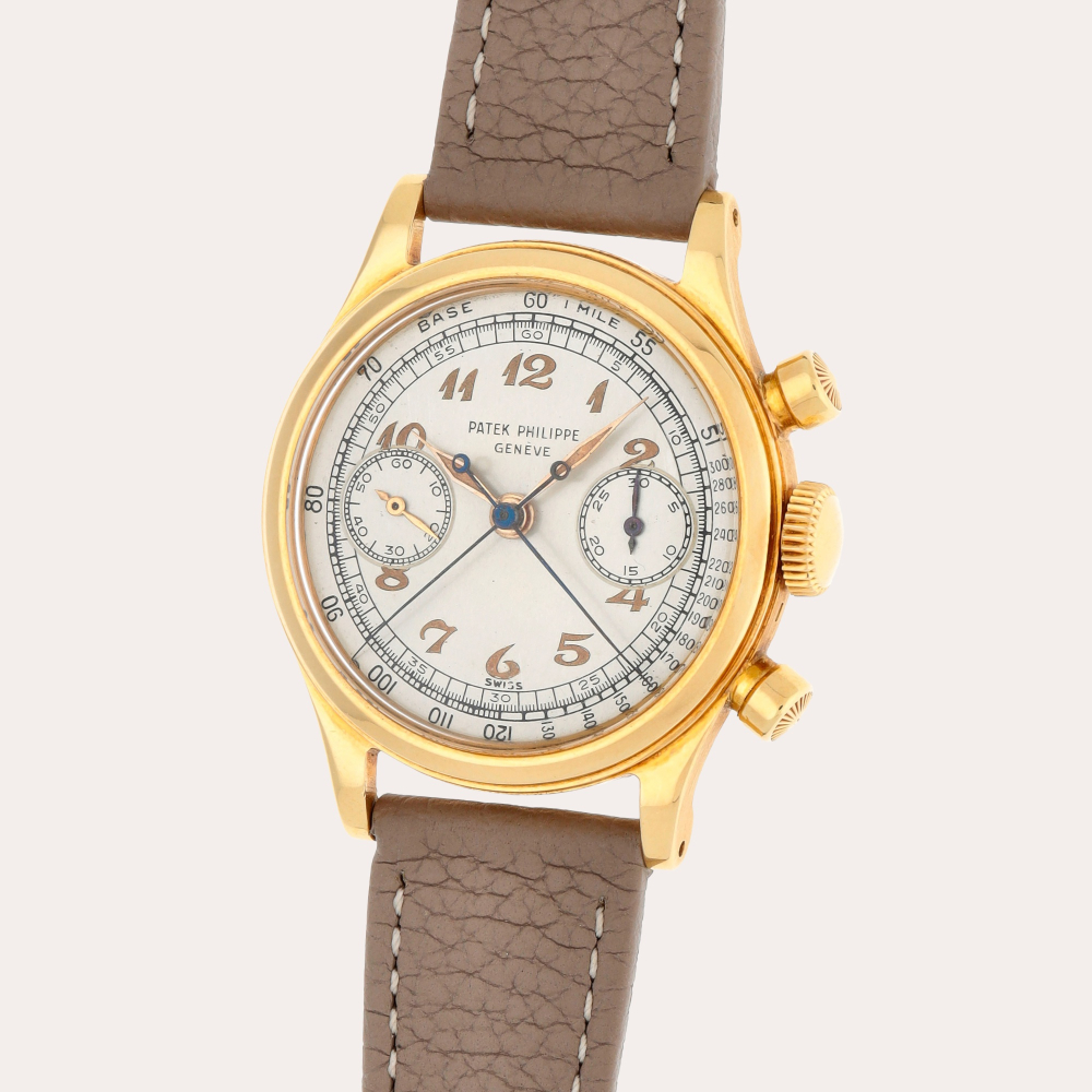Patek Philippe Reference 1563 | A unique yellow gold split-second chronograph wristwatch with luminous Breguet numerals and hands | Made in 1947