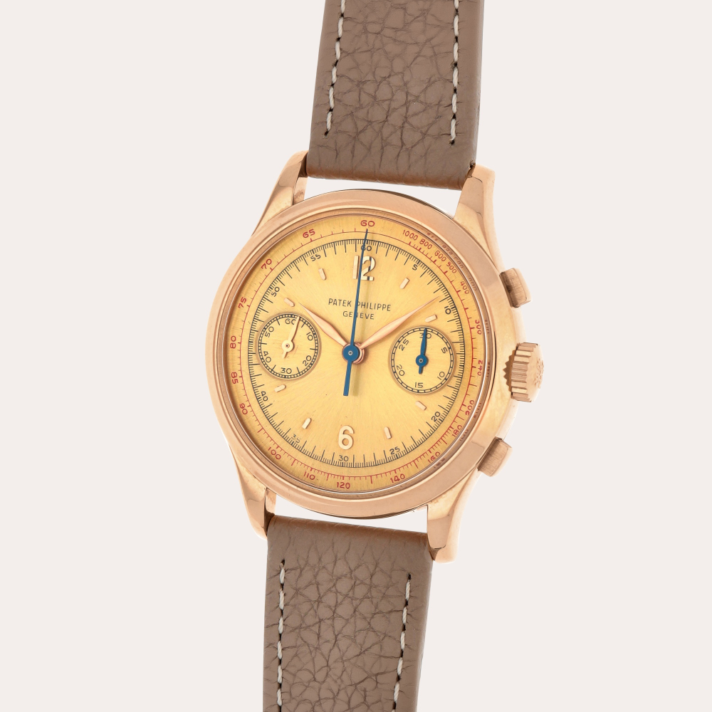 Patek Philippe Reference 530 | A pink gold chronograph wristwatch with pink satin sunburst dial | Made in 1952