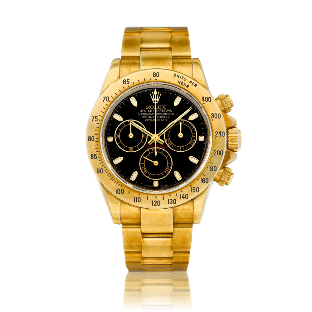 Cosmograph Daytona Reference 116528  A yellow gold chronograph wristwatch with bracelet Circa 2002    Cosmograph Daytona 116528  2002