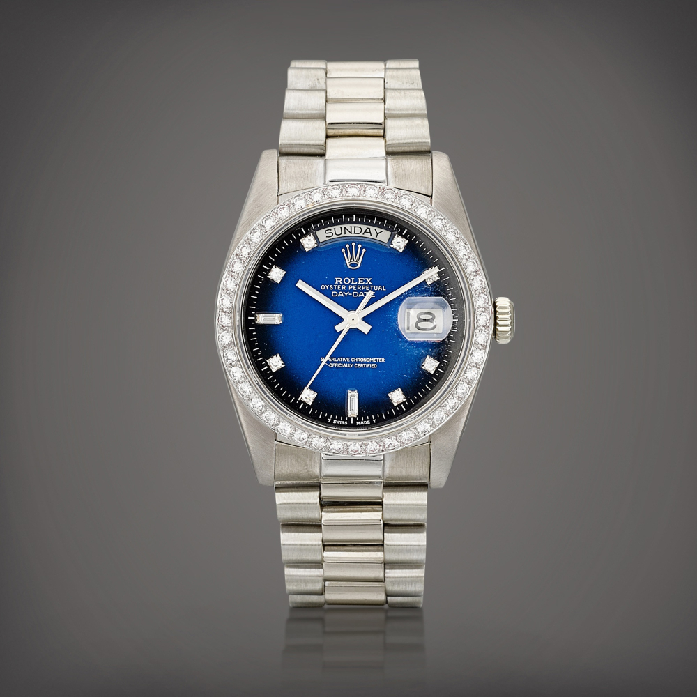 DayDate Reference 18049  A white gold and diamondset wristwatch with day date blue dgrad dial and bracelet Circa 1983    DayDate 18049  1983