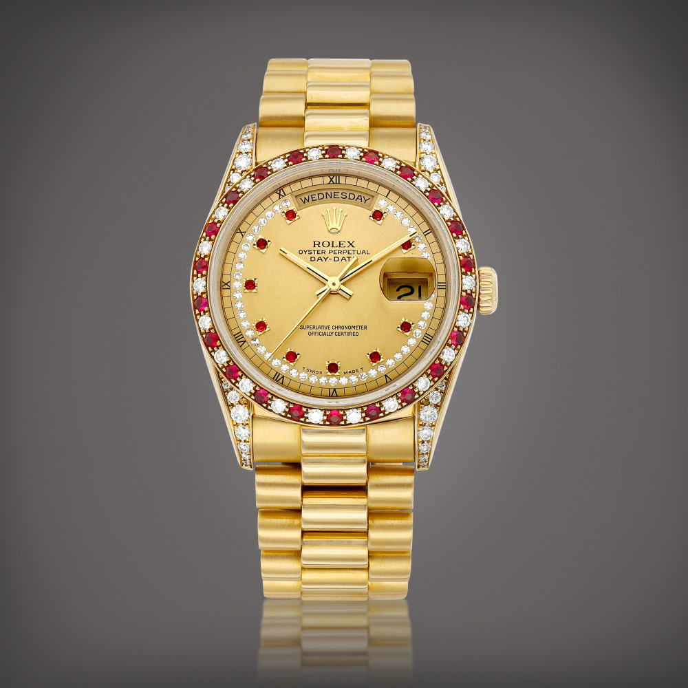 DayDate Reference 18388  A yellow gold diamond and rubyset wristwatch with day date and bracelet Circa 1990    DayDate 18388  1990
