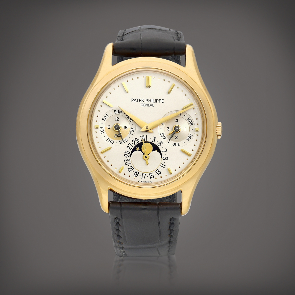 PROPERTY FROM AN IMPORTANT ASIAN COLLECTOR  Patek Philippe  Reference 3940 A yellow gold perpetual calendar wristwatch with moon phases, 24 hours and leap year indication, Circa 1988 