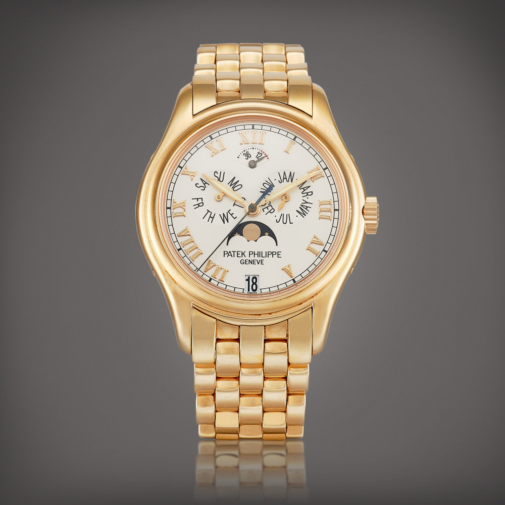 PROPERTY FROM A PROMINENT COLLECTOR  Patek Philippe  Reference 5036 A pink gold annual calendar wristwatch with moon phases, power reserve indication and bracelet, Circa 2000 