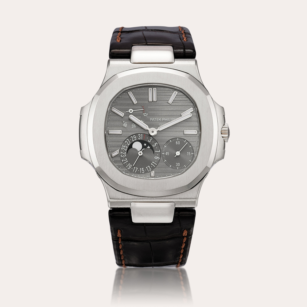 Patek Philippe Nautilus, Reference 5712 | A white gold wristwatch with date, moon phases and power reserve indication, Circa 2009 | 百達翡麗 | Nautilus 型號5712 | 白金腕錶，備日期、月相及動力儲備顯示，約2009年製