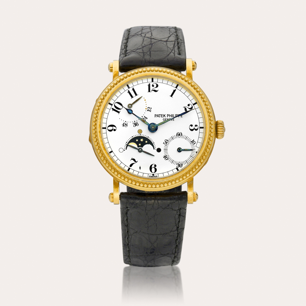 Patek Philippe Reference 5015 | A yellow gold wristwatch with moon phases and power reserve indication, Made in 1994 | 百達翡麗 | 型號5015 | 黃金腕錶，備月相及動力儲備顯示，1994年製