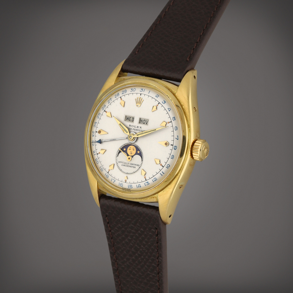 Reference 6062 | A yellow gold triple calendar wristwatch with moon phases | Circa 1953