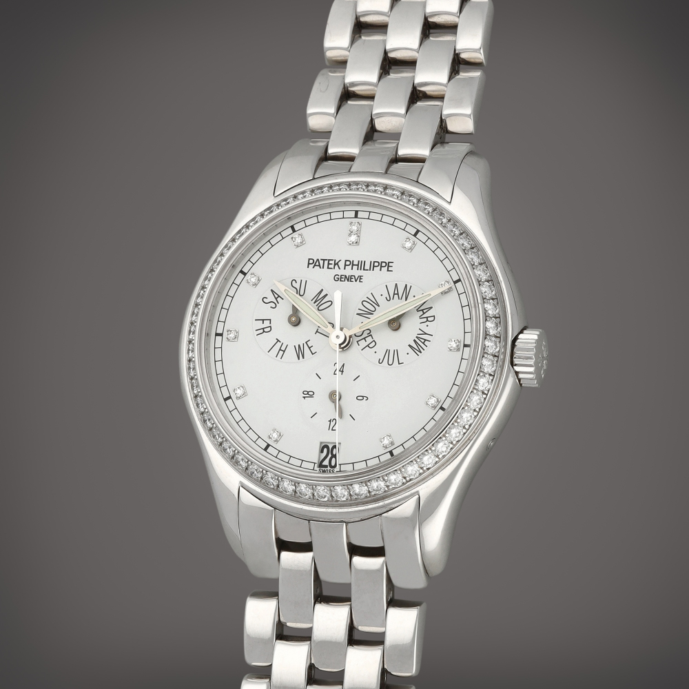 Patek Philippe Reference 5037/1 | A white gold and diamond-set annual calendar wristwatch with 24 hours indication and bracelet | Circa 2002