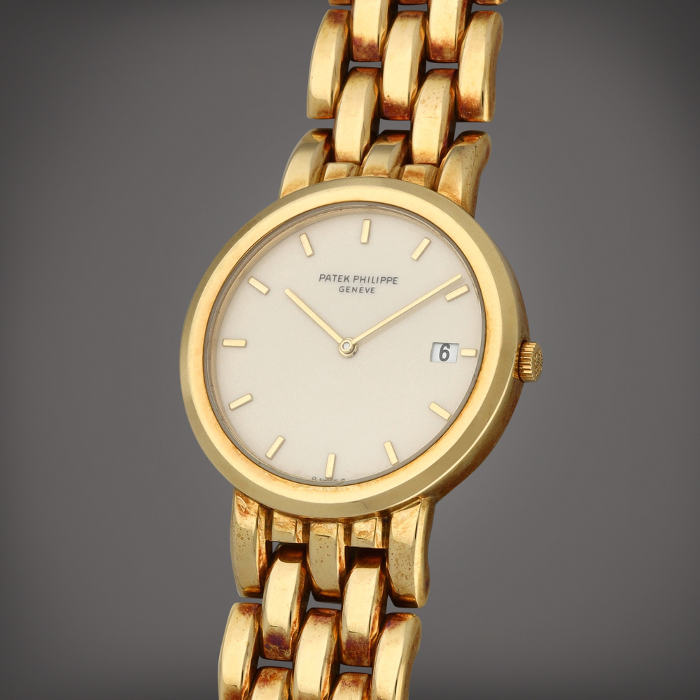 Patek Philippe Reference 3937/3 | A yellow gold wristwatch with date and bracelet | Circa 1986