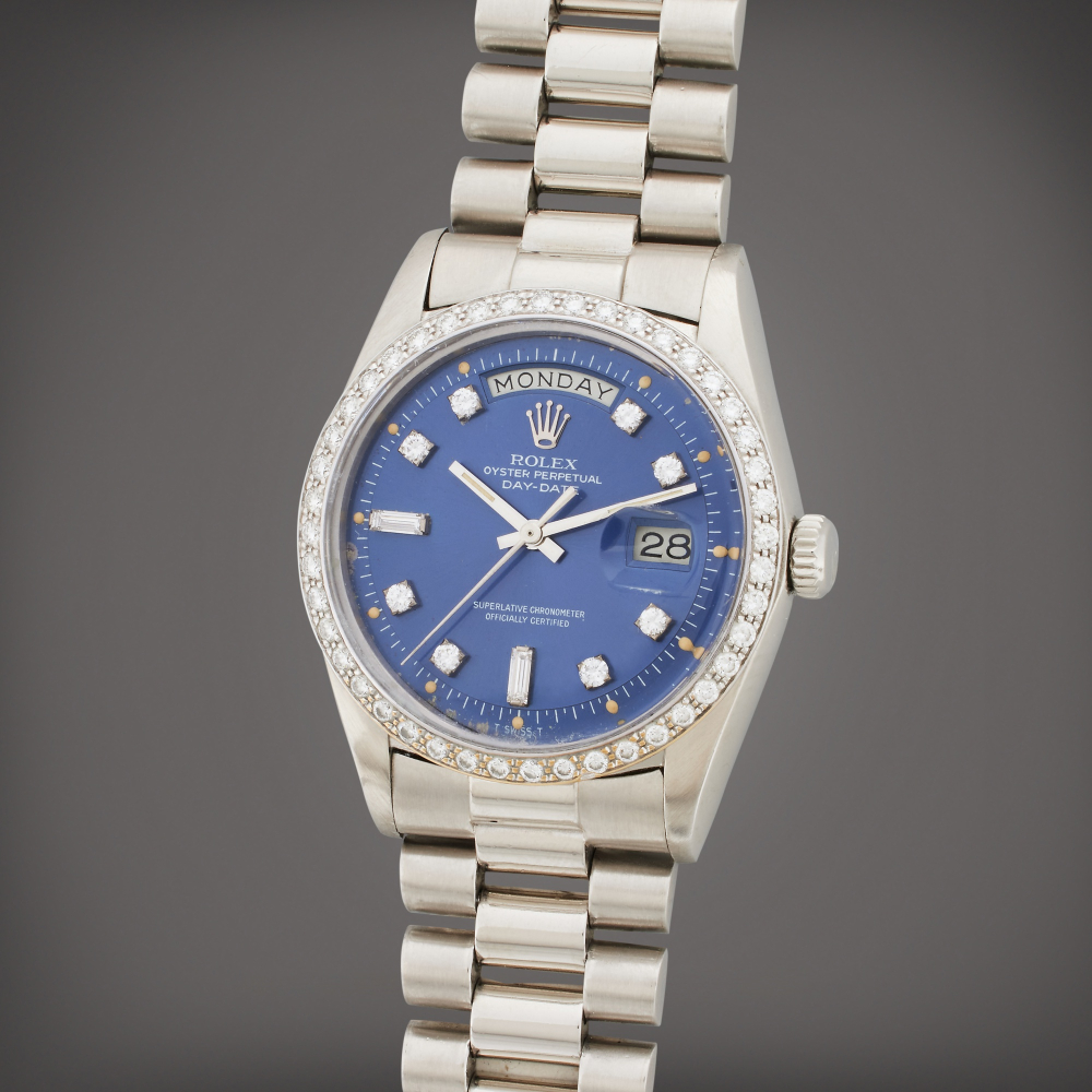 Reference 1804 Day-Date | A platinum and diamond-set wristwatch with day, date, and bracelet, Circa 1978