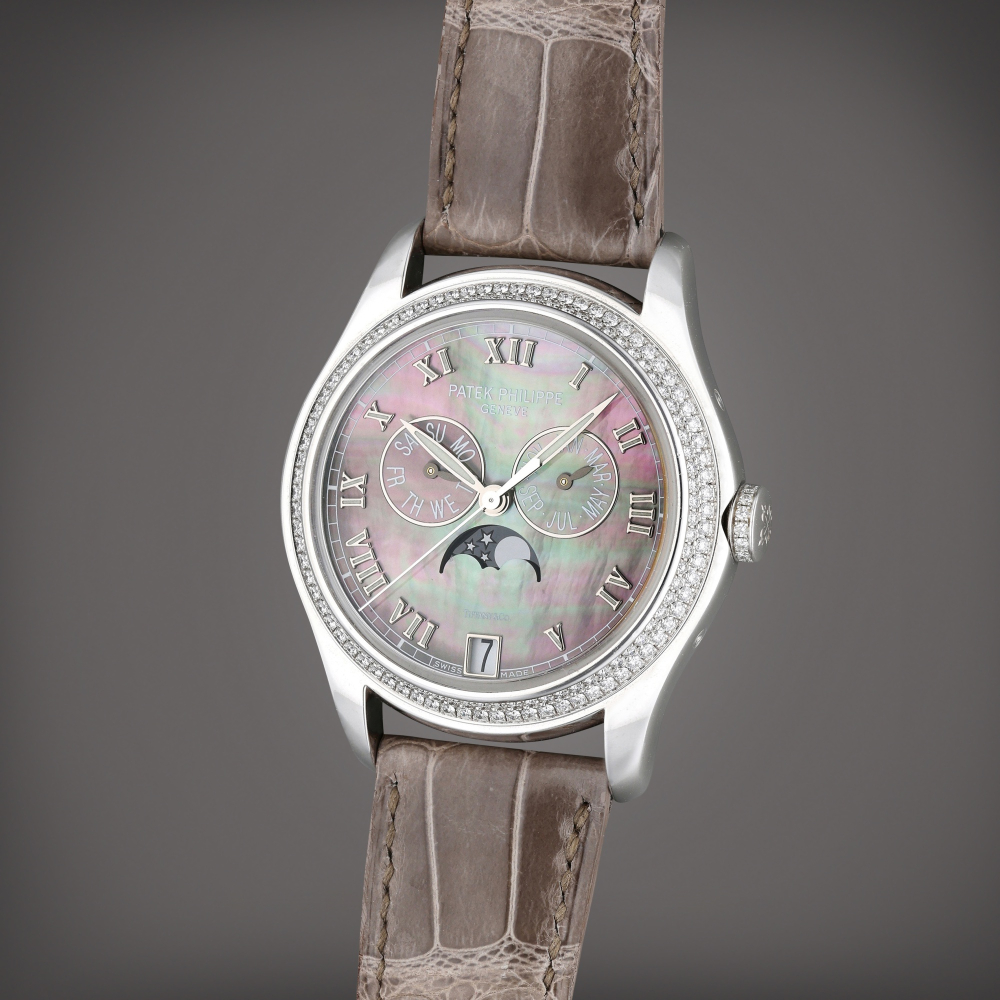 Reference 4936G-001 Retailed by Tiffany Co.: | A white gold and diamond-set annual calendar wristwatch with moon phases and Mother of pearl dial, Circa 2008