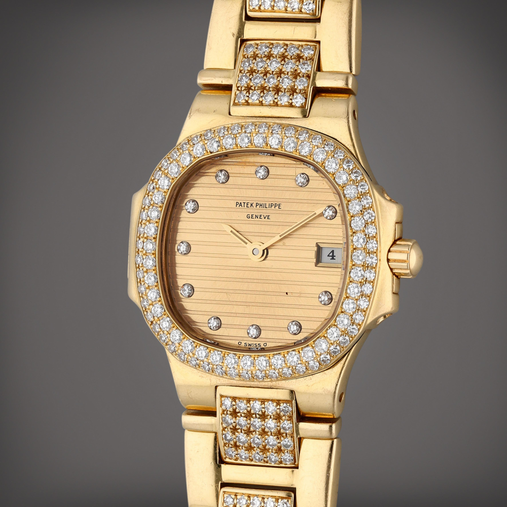 Reference 4700/55 Nautilus | A yellow gold and diamond-set wristwatch with date and bracelet Circa 1985