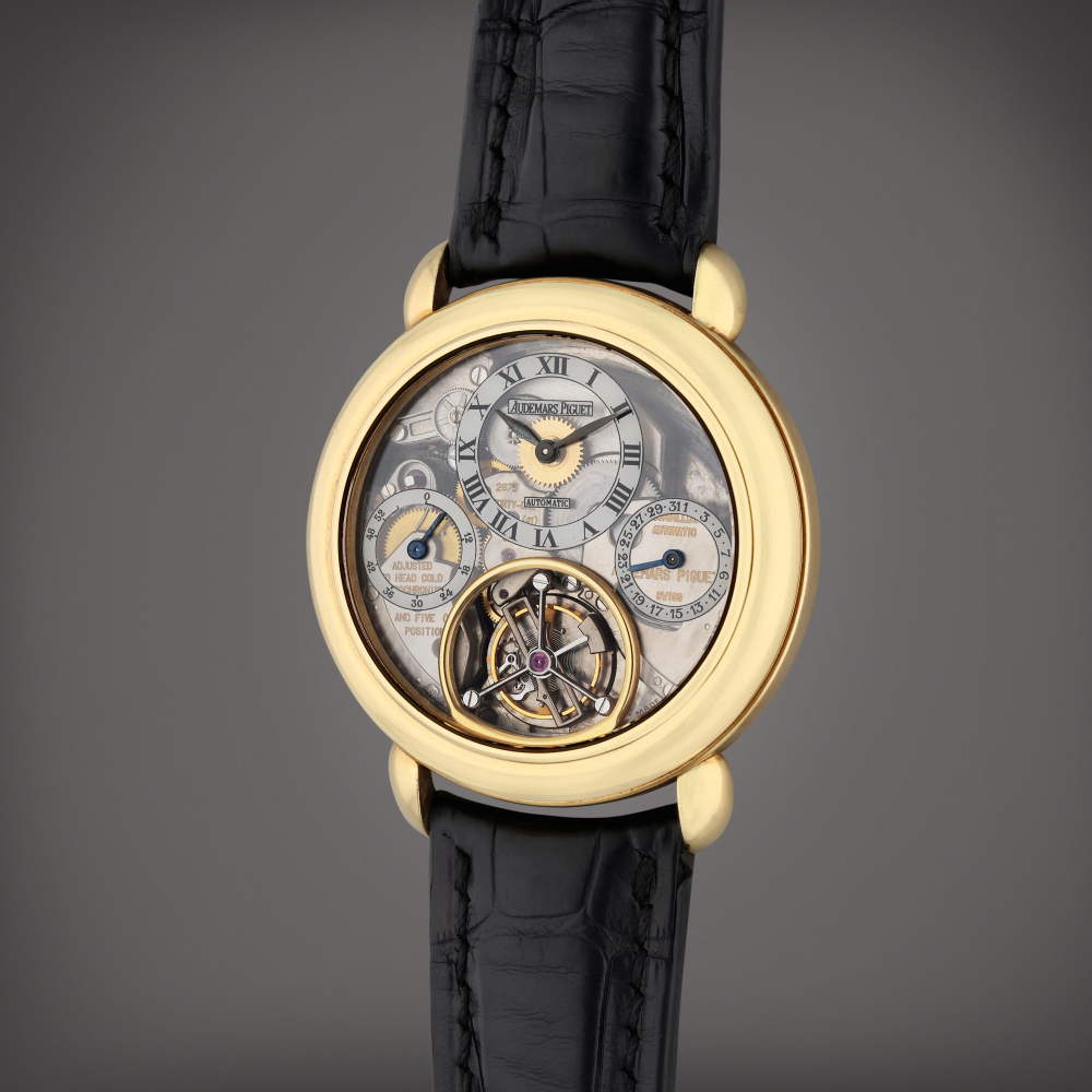 Jules Audemars Tourbillon | A rare yellow gold skeletonized automatic back wound tourbillon wristwatch with date and power reserve indication, Circa 1995