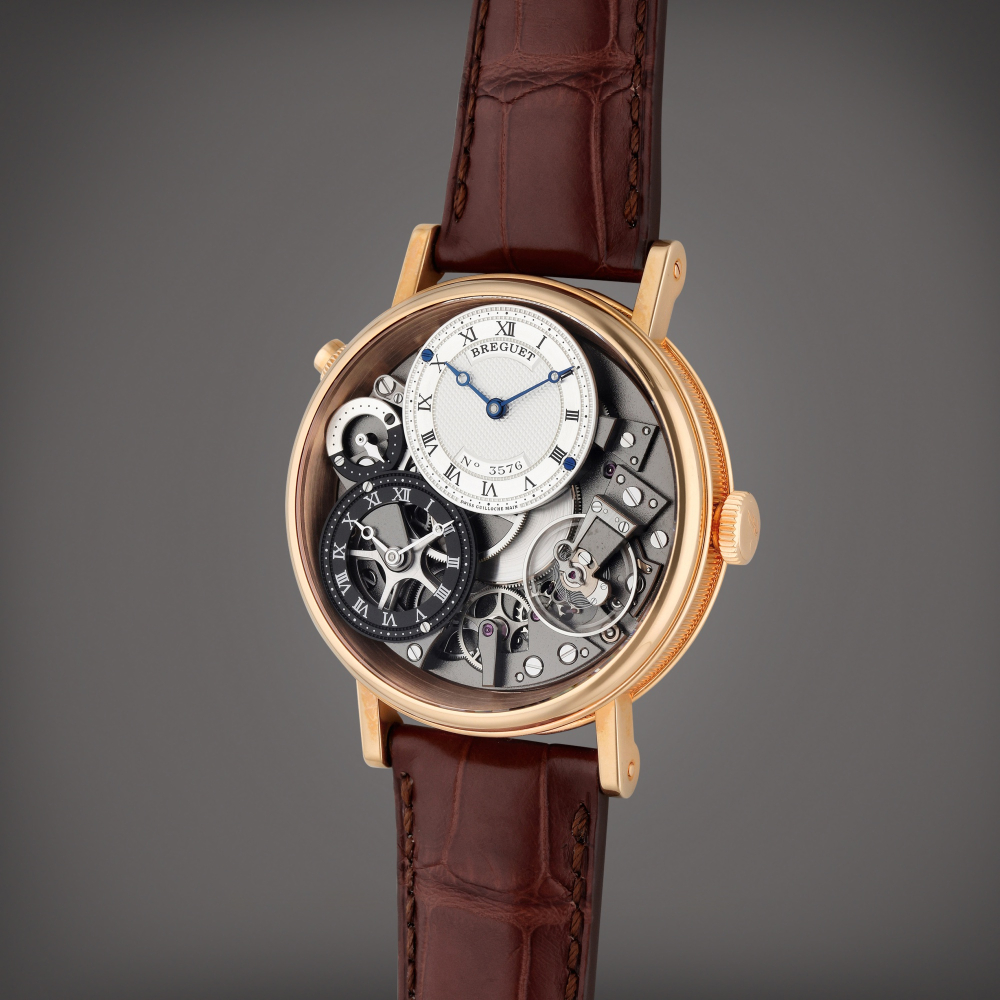 Breguet Reference 7067 Tradition GMT | A pink gold semi-skeletonized dual time wristwatch day/night indication, Circa 2014