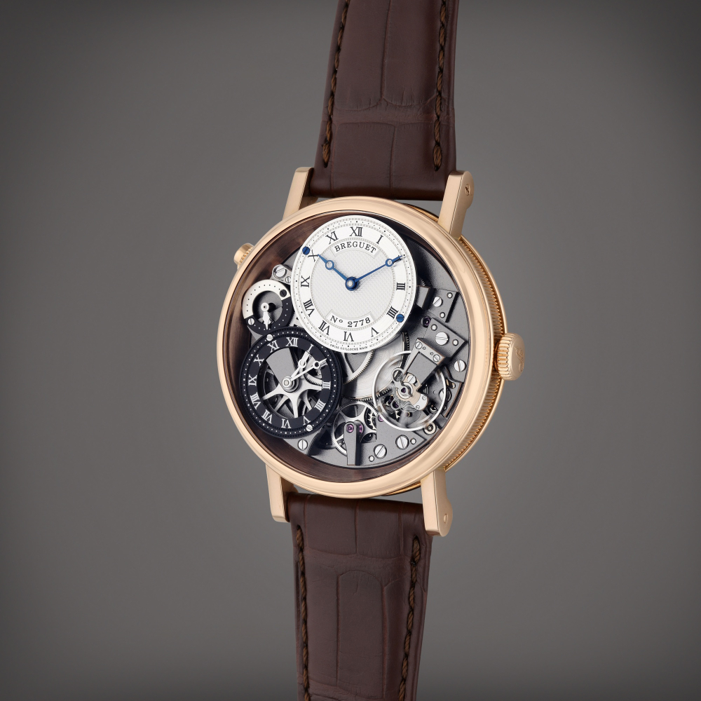 Breguet Reference 7067 Tradition GMT | A pink gold semi-skeletonized dual time wristwatch Day/Night indication, Circa 2021