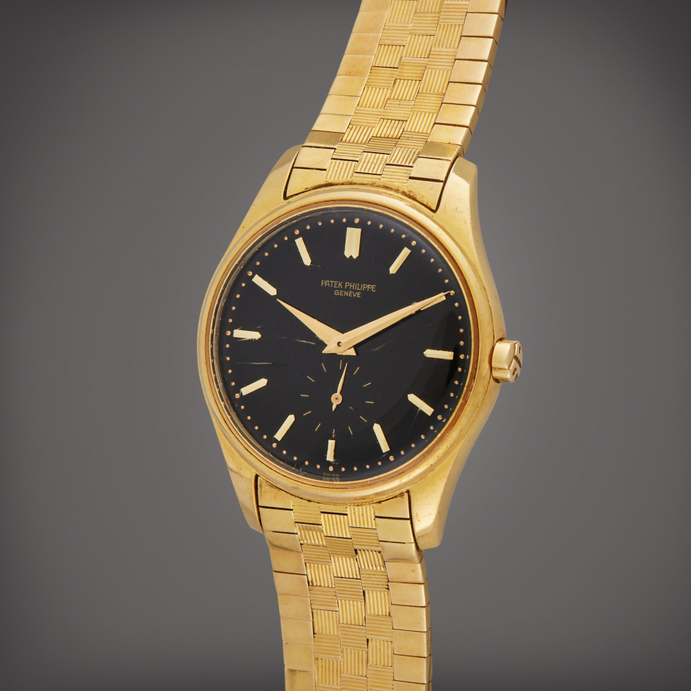 Patek Philippe Reference 3428 | A yellow gold automatic wristwatch with black dial, Circa 1961