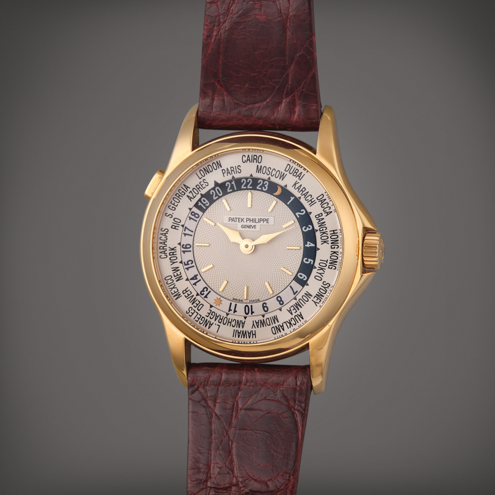 Patek Philippe Reference 5110 World Time | A yellow gold automatic world time wristwatch, Made in 2002