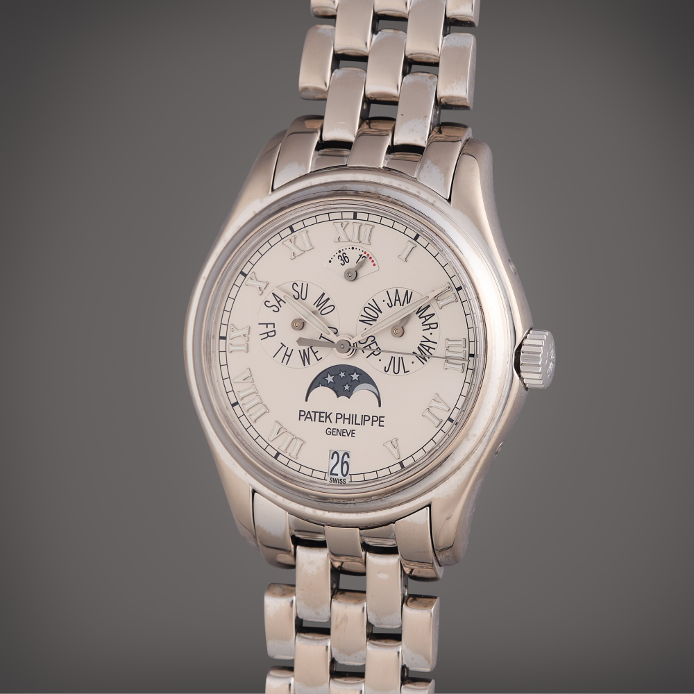 PROPERTY OF A PRIVATE COLLECTOR Patek Philippe Reference 5036/1 | A white gold automatic annual calendar wristwatch with moon phases, power reserve indication, and bracelet, Circa 2002