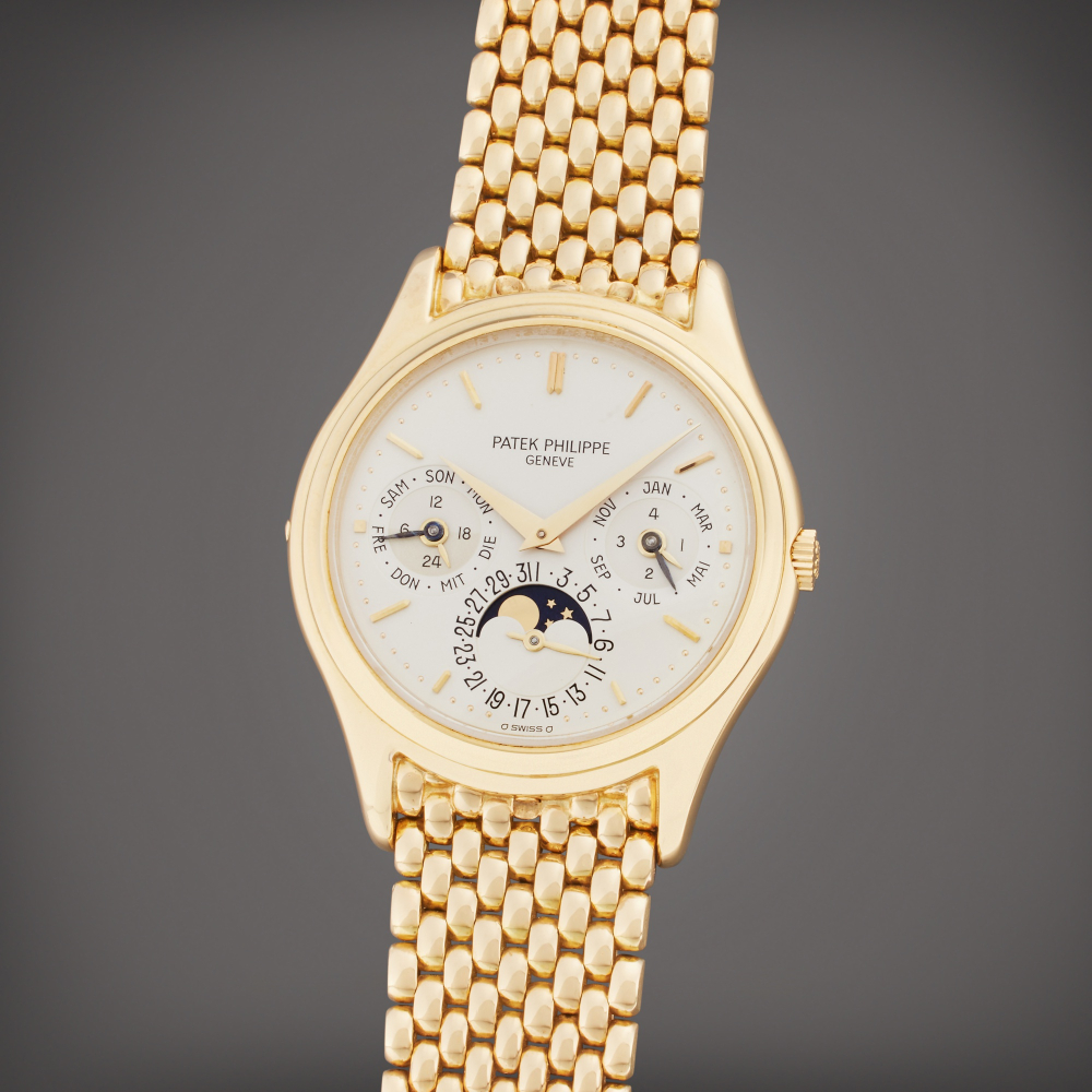 Patek Philippe Reference 3940 | A yellow gold automatic perpetual calendar bracelet watch with moon phases, 24 hour indication, and leap year indication, Made in 1987