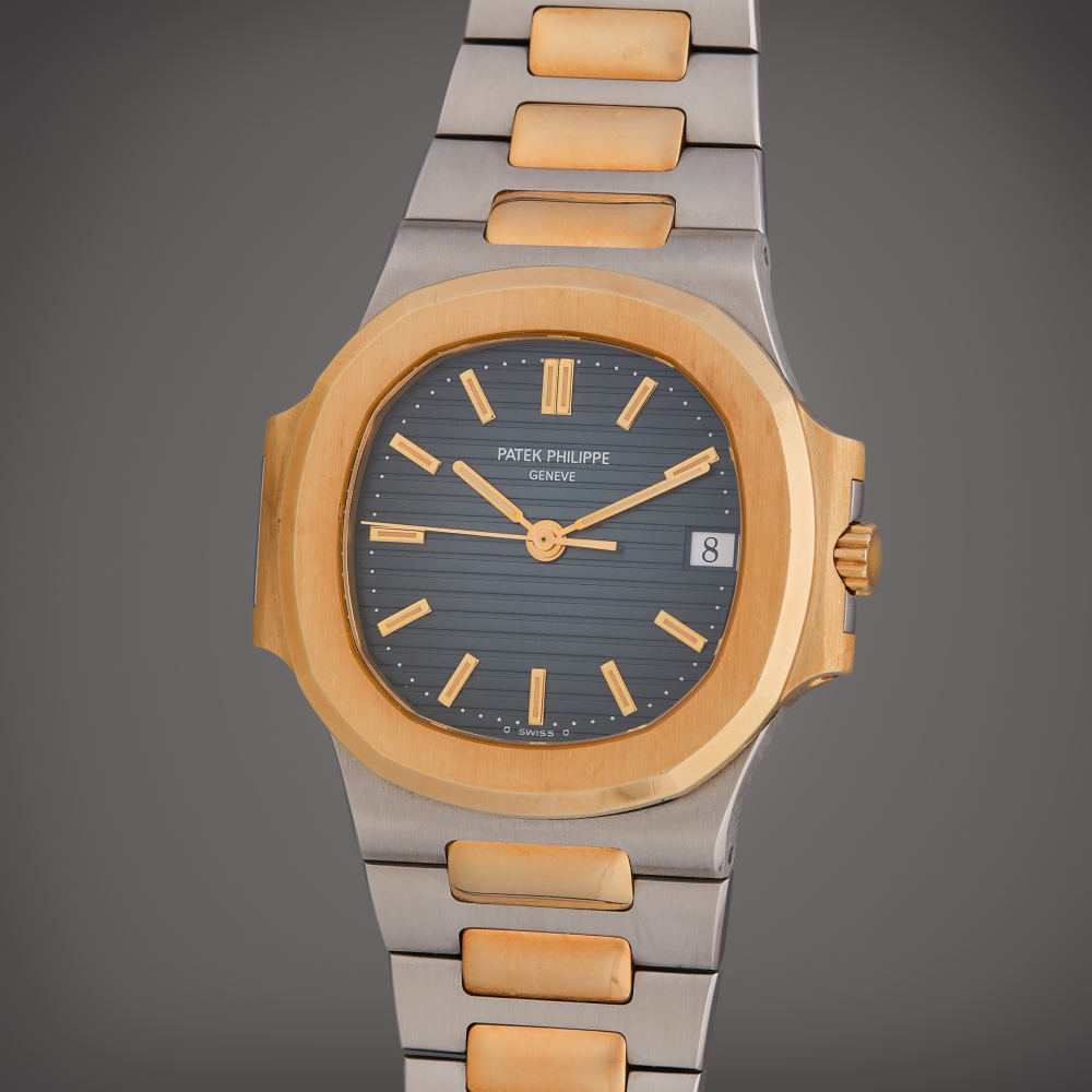 Patek Philippe Reference 3800/1JA Nautilus | A stainless steel and yellow gold automatic wristwatch with date and bracelet, Circa 1996