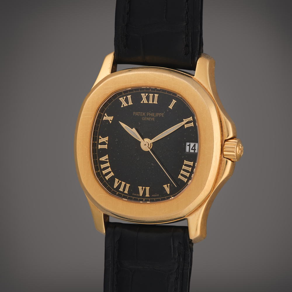 Patek Philippe Reference 5060 Aquanaut | A yellow gold automatic wristwatch with date, Circa 2000