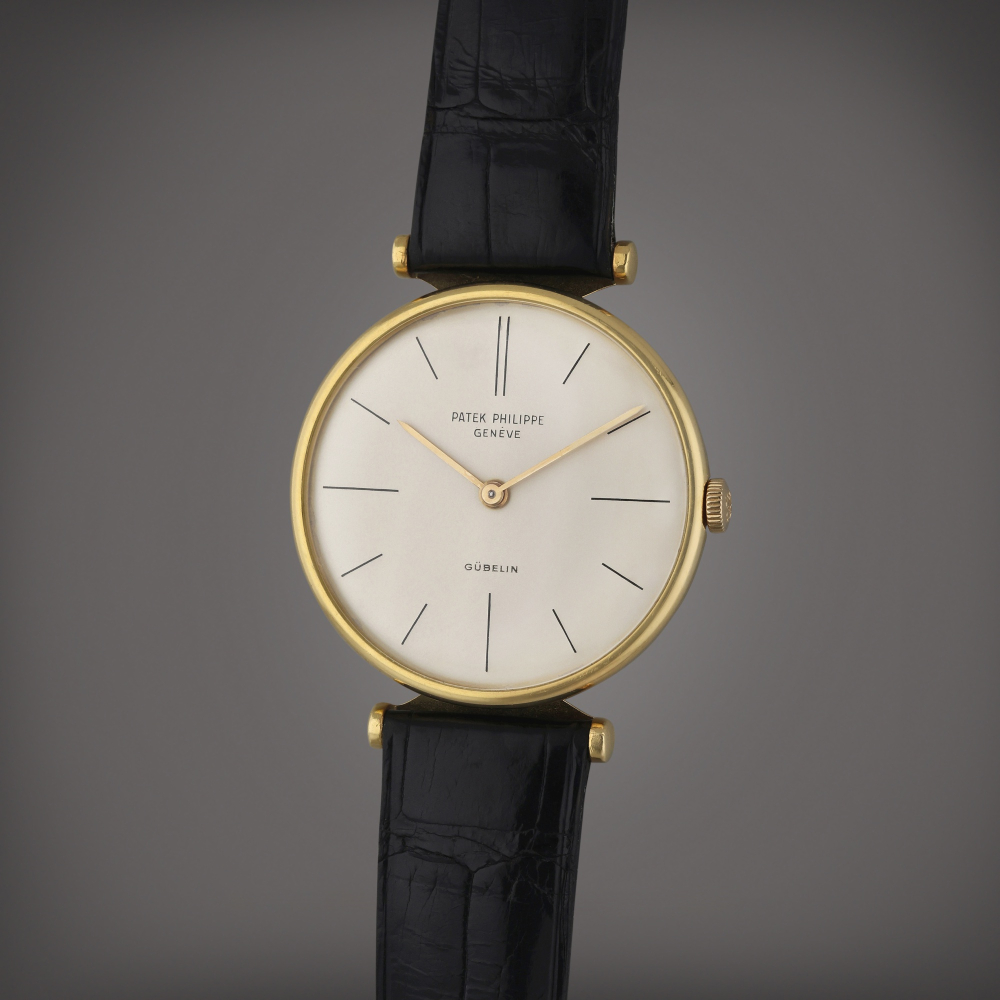 Patek Philippe Reference 2592 | Retailed by Gübelin: A yellow gold wristwatch, Circa 1961