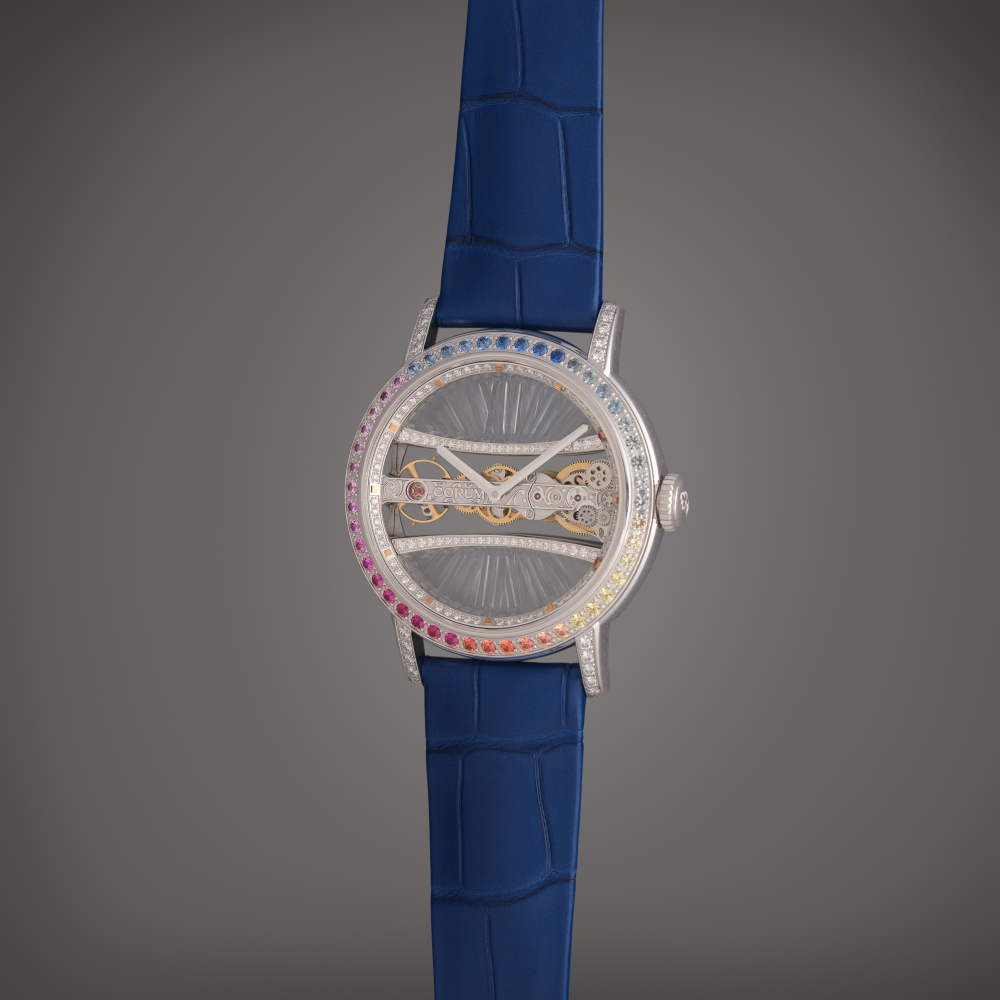 Corum Reference 05.0089 Golden Bridge Round | A white gold, diamond, and sapphire-set skeletonized wristwatch, Circa 2020