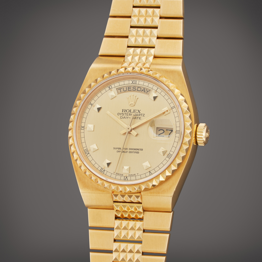 Rolex Reference 19028 Oysterquartz Day-Date 'Pyramid' | A yellow gold wristwatch with day, date and bracelet, Circa 1987