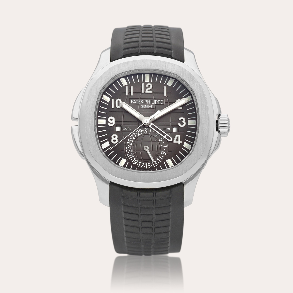 Patek Philippe Reference 5164A-001 Aquanaut | A stainless steel dual time zone wristwatch with date and day/night indication, Circa 2016