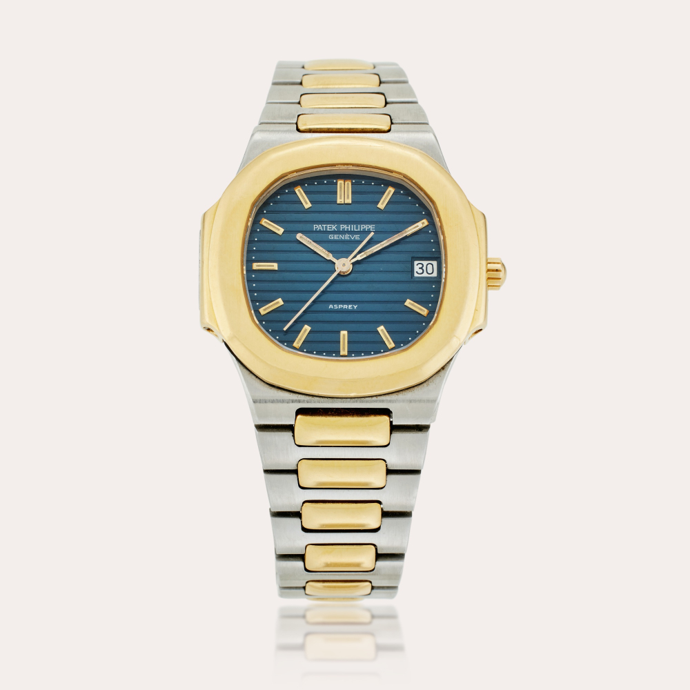 PROPERTY FROM THE FAMILY OF THE ORIGINAL OWNER Patek Philippe Reference 3900/1 Nautilus | Retailed by Asprey: A rare stainless steel and yellow gold bracelet watch with date, Circa 1985