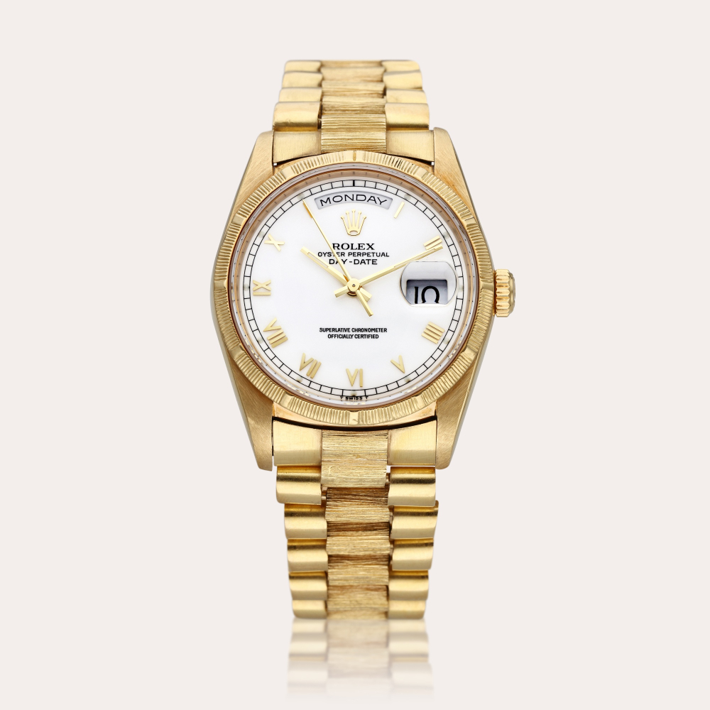 Rolex Reference 18248 Day-Date ‘Bark’ | A yellow gold automatic wristwatch with day, date, and bark finish bezel and bracelet, Circa 1988