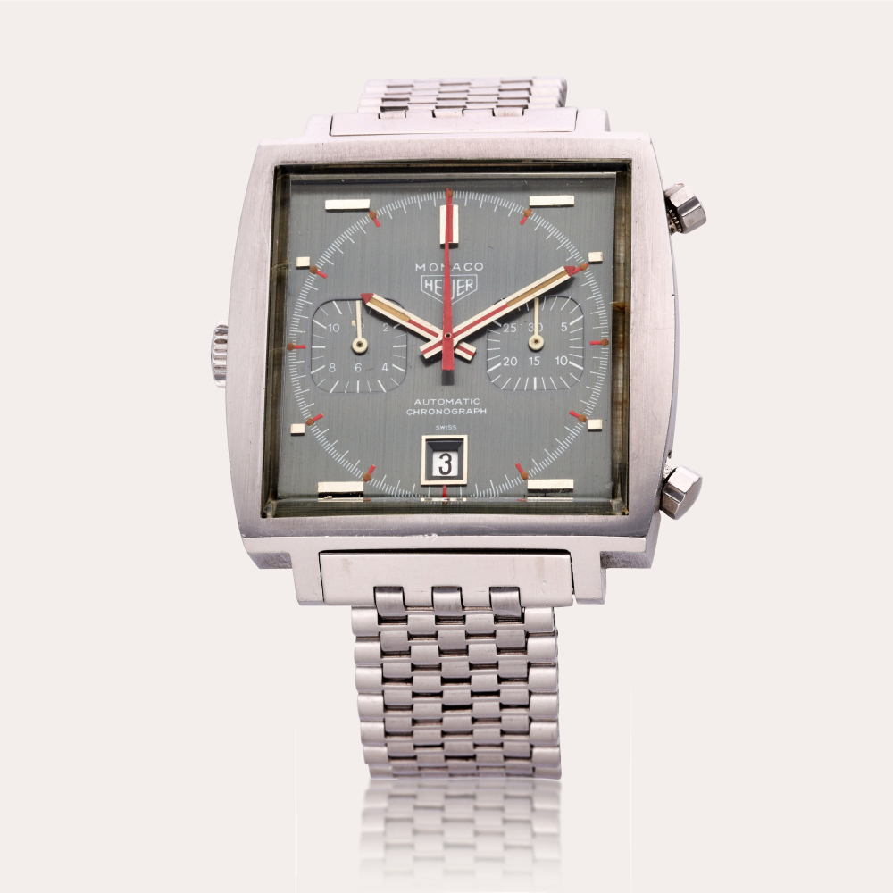 CONSIGNED BY TIMEPIECE GRADING SPECIALISTS Heuer Reference 1133 Monaco | A stainless steel automatic chronograph wristwatch with date and bracelet, Circa 1975