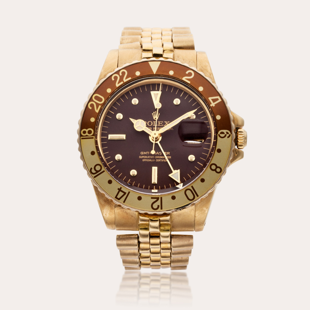 Rolex Reference 1675 GMT-Master | A yellow gold automatic dual time wristwatch with date and bracelet, Circa 1971