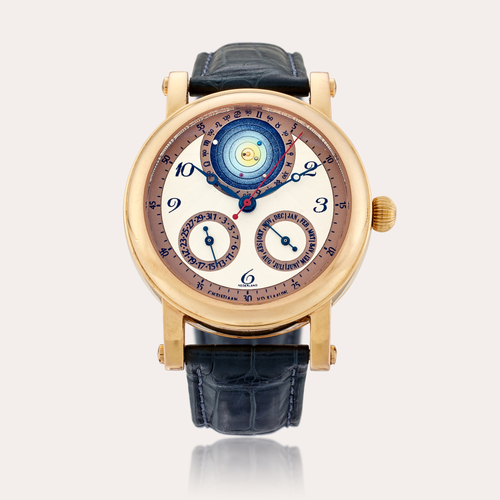 Christiaan Van Der Klaauw Planetarium 2000 | A pink gold automatic wristwatch with month, date, and planetarium aperture depicting the relative placement of the planets around the sun, Circa 2005