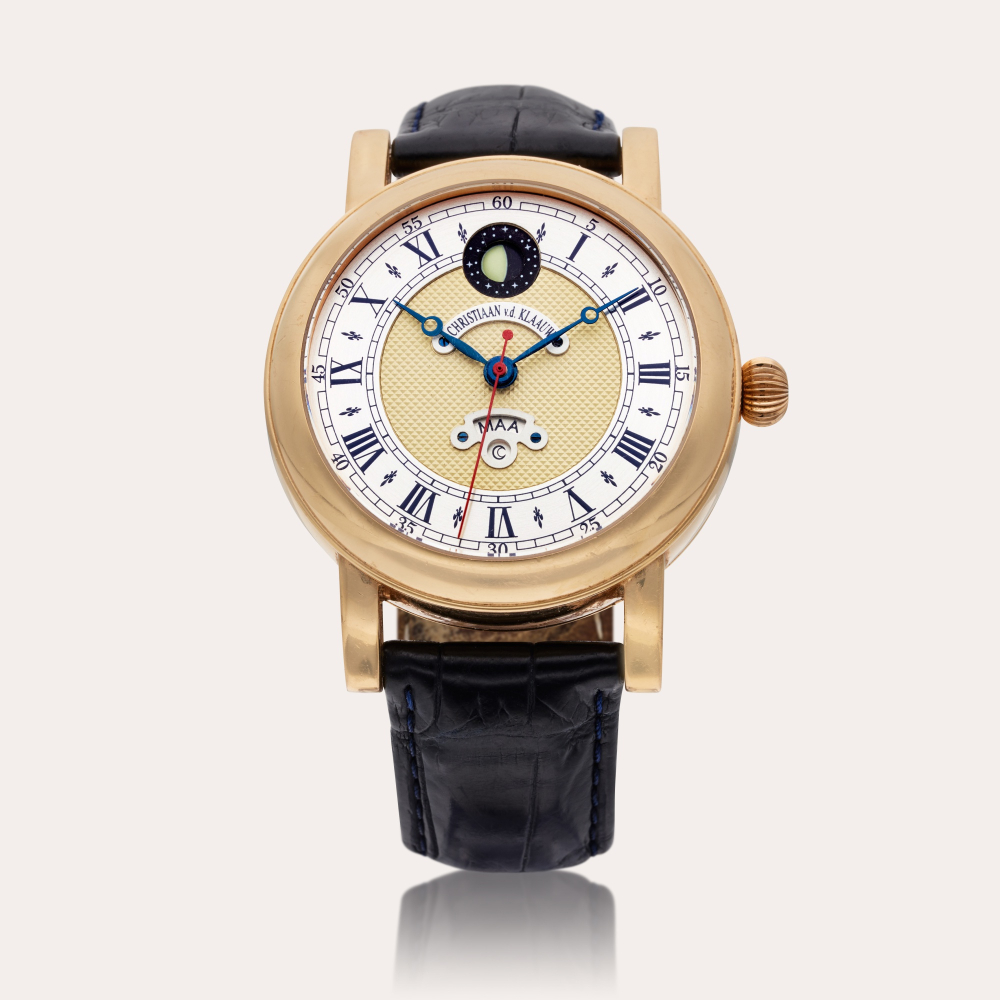 Christiaan Van Der Klaauw Joure | A pink gold automatic wristwatch with day indication with corresponding celestial bodies and moon phases, Circa 2005