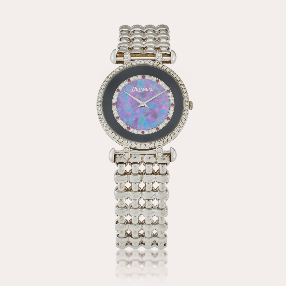 DeLaneau Reference G411/90 | A white gold, diamond and ruby-set bracelet watch with opal and onyx dial, Circa 1994